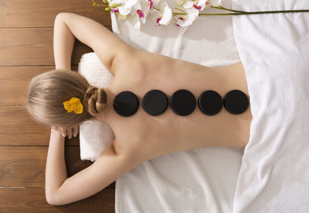 spa stone massage concept girl on massage table 2021 08 27 14 46 57 utc Medical Massage of Tulsa