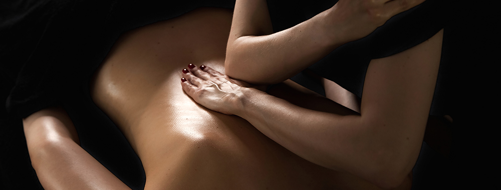 Massage Tulsa being performed with focused therapeutic pressure on the back