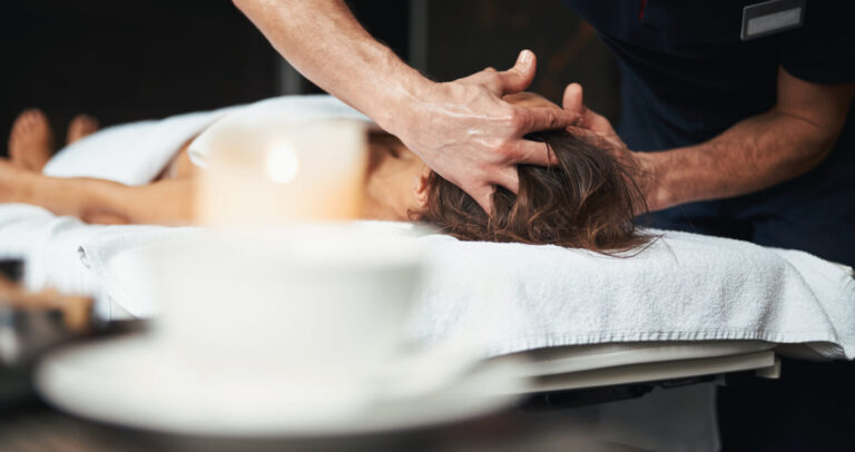 Massage Tulsa being performed on a client’s head and neck to promote relaxation