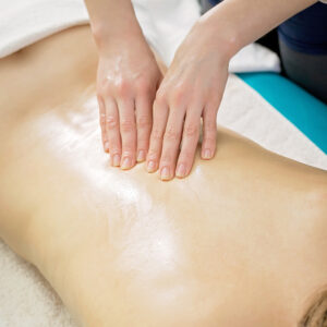 tulsa swedish massage being performed on a client’s back with smooth, relaxing strokes