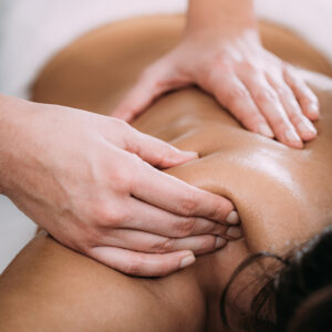 tulsa swedish massage being performed on a client’s shoulders and upper back using smooth pressure
